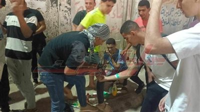 رسم العلم الفلسطيني على الوجوه والأيدي بالمنوفية