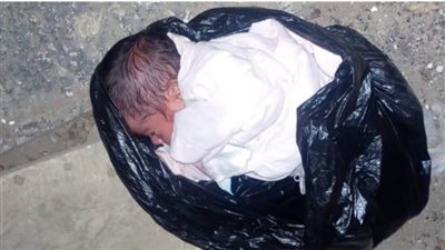 العثور على طفل وسط القمامة في القناطر الخيرية