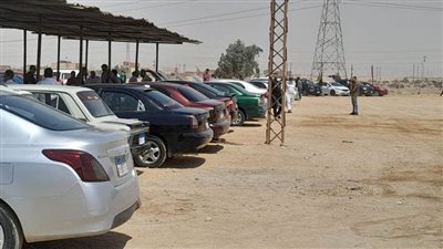 إجراءات ضبط التشغيل وتطبيق مقابل الانتظار بساحة سوق السيارات ببني سويف