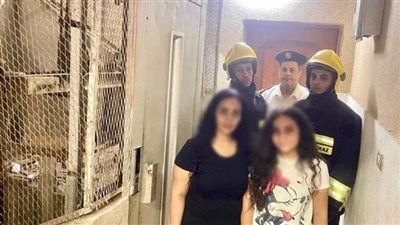 أمن الفيوم ينقذ سيدة ونجلتها من داخل مصعد عقار 