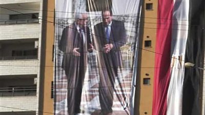 «السيسي وأبو مازن» في شوارع غزة إلى جانب علم مصر