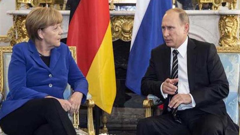 بوتين وميركل يؤكدان