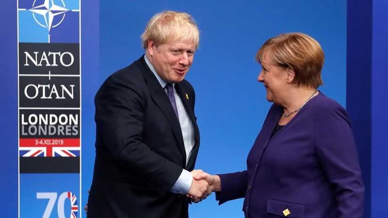 جونسون وميركل يدينان