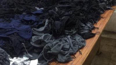 شرطة التموين تضبط مصنعا للكمامات يصنعها من خامات مجهولة