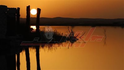 مشهد غروب الشمس من جزيرة فطناس بواحة سيوة