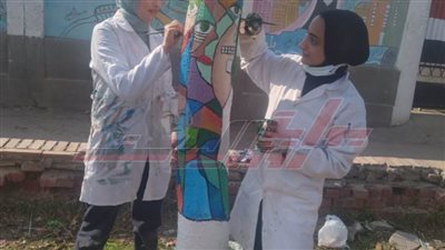 تزيين الأشجار بشوارع كفر الشيخ بأيدي طالبات تربية نوعية