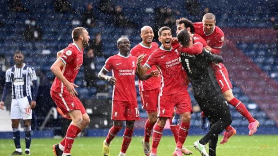 محمد صلاح أثناء احتفاله مع أليسون