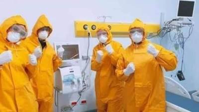 بالصور.. مستشفى العزل بالعجمي يحتفل بشفاء 11 حالة مصابة بكورونا