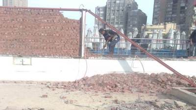 مصدر أمني ينفي قيام الأمن بإزالة سور نادى الزمالك النهري