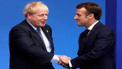 جونسون وماكرون يتفقان على أن إيجاد حل دبلوماسي للتوترات بشأن أوكرانيا يظل الأولوية