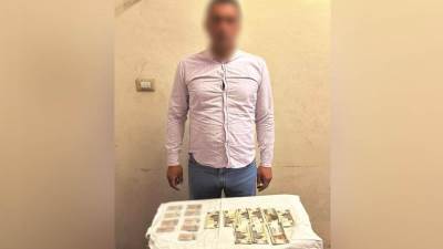  ضبط شخص بحوزته بطاقات شخصية ومبالغ مالية بالغربية